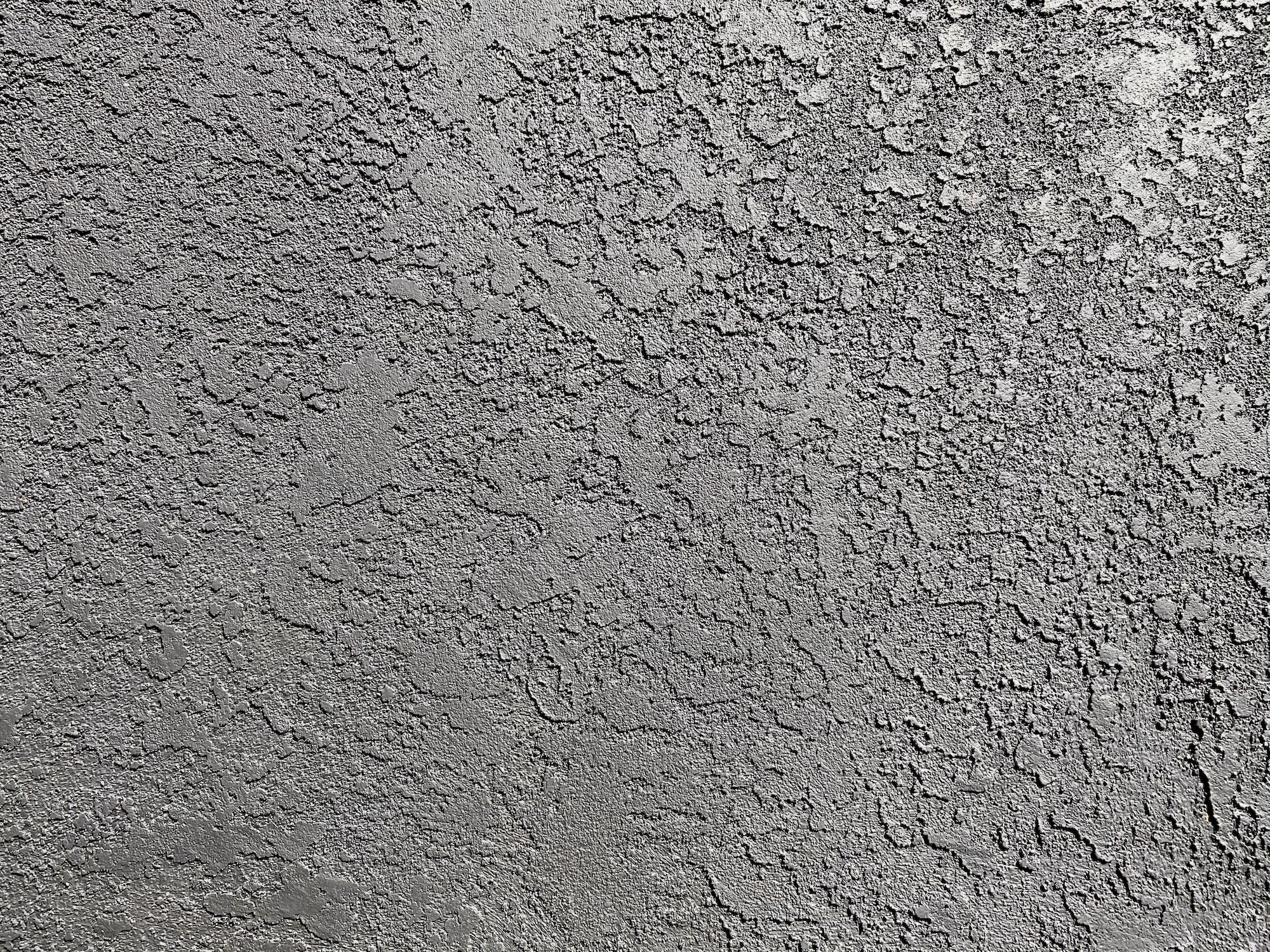 Textured slate gray stucco background